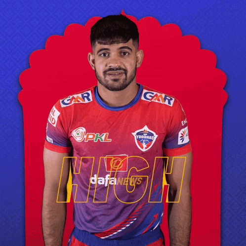 a man wearing a red and blue yoddhas shirt