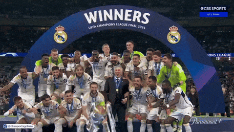 a group of soccer players are posing for a photo with a banner that says winners