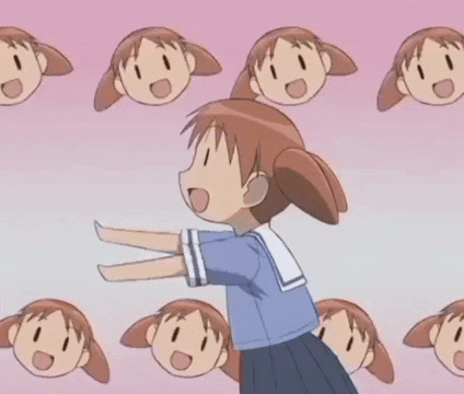 a girl in a school uniform stands in front of a wall of cartoon faces