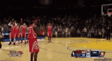 a group of basketball players on a court with a banner that says bend the voice on it