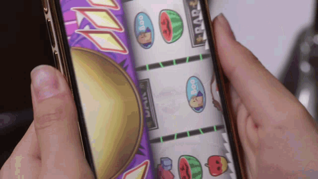 a person is playing a slot game on their phone with the word rad on the screen