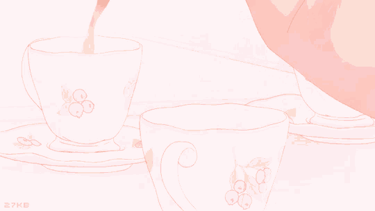 a cup of tea is being poured into a cup with a floral design