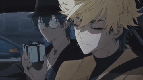 two anime characters sitting in a car with one holding a gift box