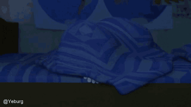 a cartoon character is peeking out from under a blanket