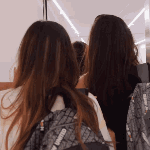 a woman with a backpack that says united