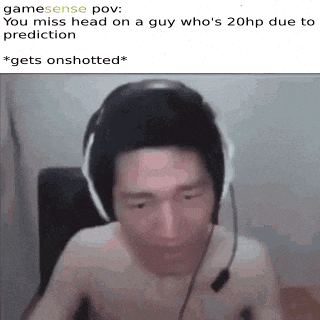 a shirtless man wearing headphones and a headset is sitting in a chair .