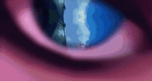 a close up of a person 's eye with a blue background