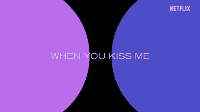 a purple and blue circle that says when you kiss me on it