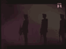 a group of soldiers are standing in a line in a dark room with a pink background .