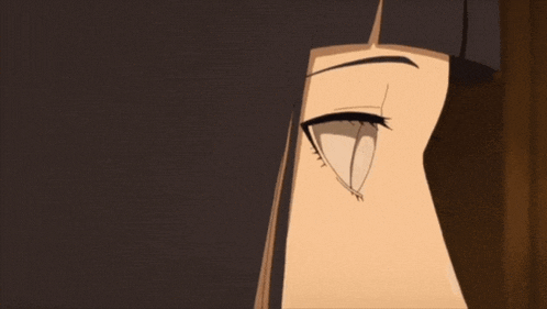 a close up of a girl 's eyes with a very dark background