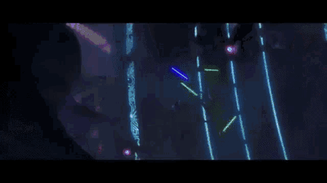 a person is holding a blue light in their hand in a dark room in a video game .