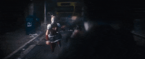 harley quinn from the video game harley quinn is holding a knife in her hand .
