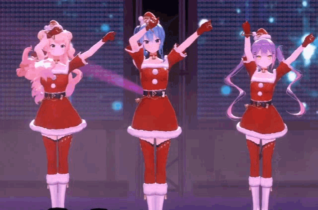 three anime girls dressed in santa outfits are dancing on stage