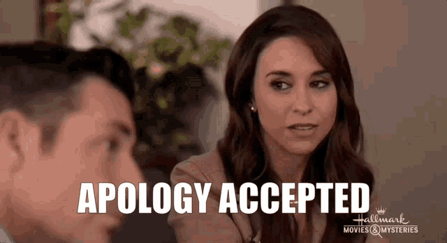 a man and woman are looking at each other and the woman says apology accepted