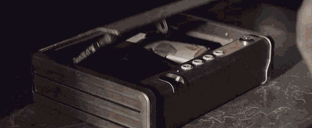a safe with a passport and a gun inside