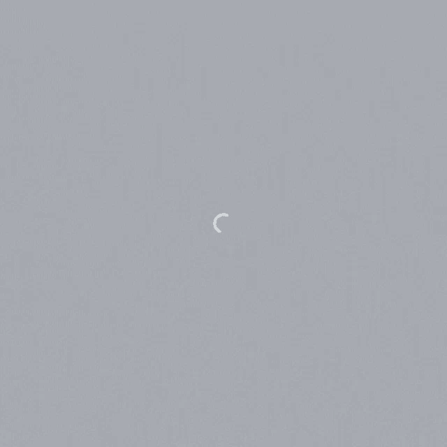 a gray background with a white circle in the middle of it
