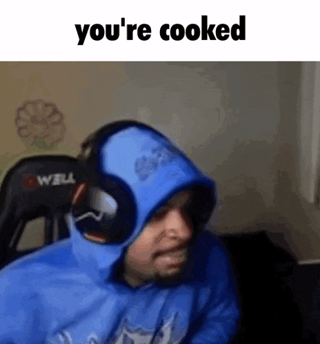 a man wearing a blue hoodie and headphones says `` you 're cooked '' while sitting in a chair .