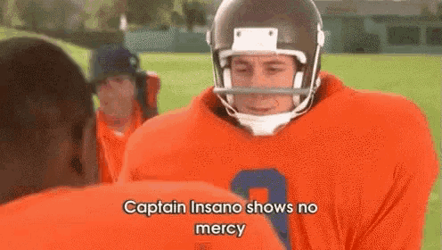 a football player wearing a helmet and an orange jersey says captain insano shows no mercy