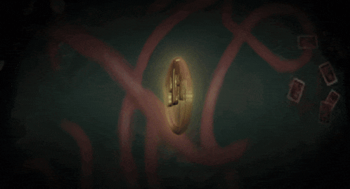 a gold circle with the letter m in it