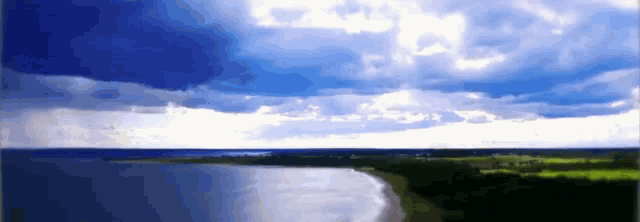 a painting of a body of water with a cloudy sky in the background
