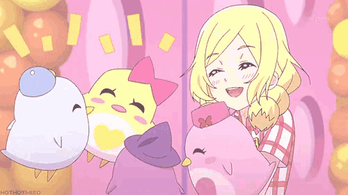 a girl in a plaid shirt is holding a pink stuffed animal and smiling