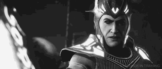 a black and white photo of a man wearing a helmet and armor with the word training on the bottom right