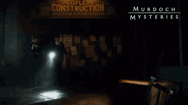 murdoch mysteries poster showing two men walking in front of a building