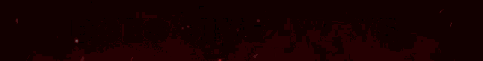 a red light is shining on a black background .