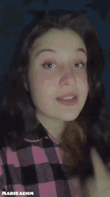 a girl in a plaid shirt says " eat rice "