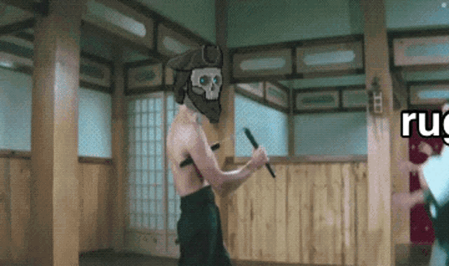 a man with a skull on his head is holding a sword in a room