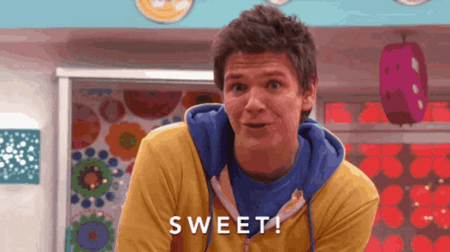 a man in a yellow sweatshirt says sweet