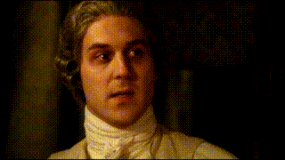 a man with a wig on his head and a white shirt