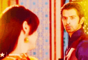 a man and woman are looking at each other with a star in the corner