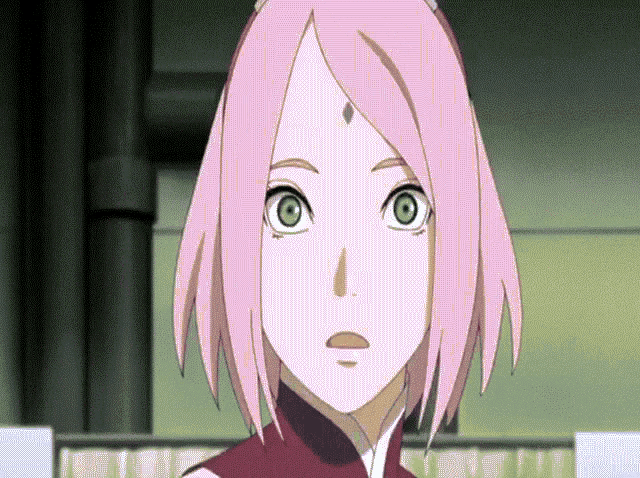 a cartoon girl with pink hair and green eyes
