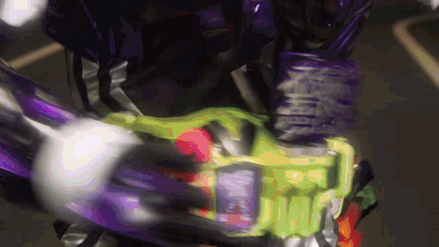 a person in a purple and green costume is holding a purple and green item