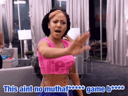 a woman in a pink top says " this aint no mutha game "