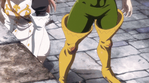 a person wearing green shorts and yellow boots has the letter o on their knee