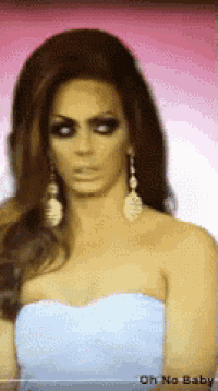 a woman wearing a white strapless dress and earrings with the words oh no baby on the bottom