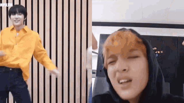 a man in a yellow shirt and a man in a black hoodie are standing next to each other in a room .