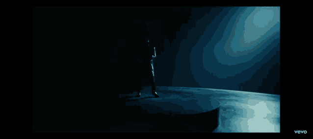 a man is dancing in a video that says vevo on the bottom right