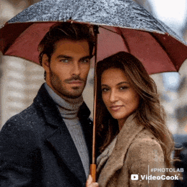 a man and a woman standing under an umbrella with #photolab videocook.m in the corner