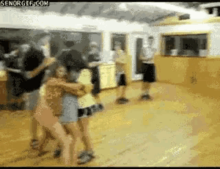 a group of people are dancing in a room with senorgif.com on the bottom right