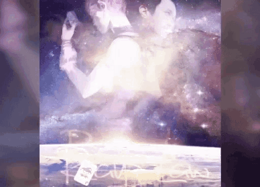 a man and a woman are standing next to each other in front of a galaxy