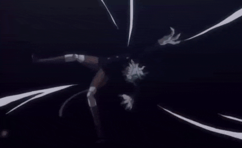 a close up of a person holding a sword in the dark .