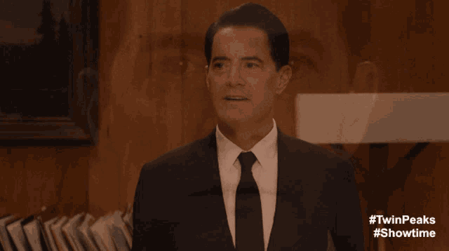 a group of people in suits and ties are standing in a room with #twinpeaks #showtime written on the bottom