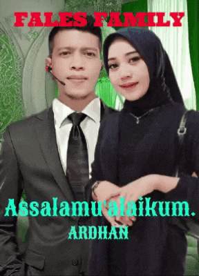 a man in a suit and tie stands next to a woman with a hijab