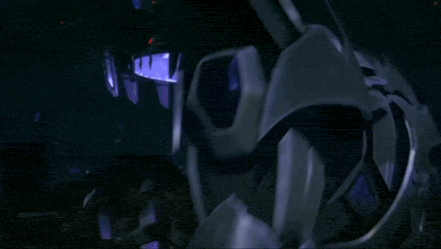 a dark room with a purple light coming out of the top