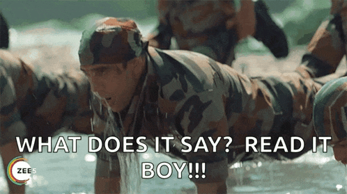 a man in a military uniform is doing push ups in the water and says " what does it say read it boy "