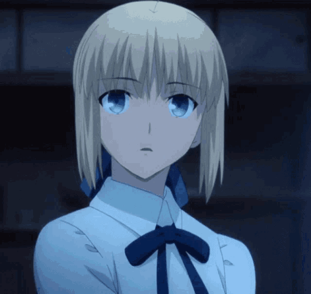 a blonde anime girl with blue eyes is wearing a white shirt and a blue bow tie