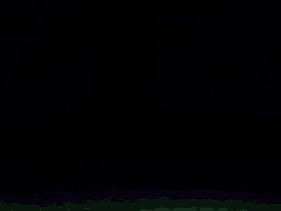 a green tiger is walking in the dark in a cartoon .